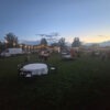 string lights, poles, tables and chairs