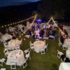 chairs and tables with string lights
