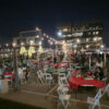 string lights, tables and chairs for christmas party