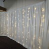 ivory drapes with fairy lights