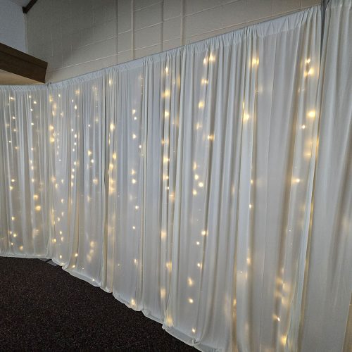 ivory drapes with fairy lights